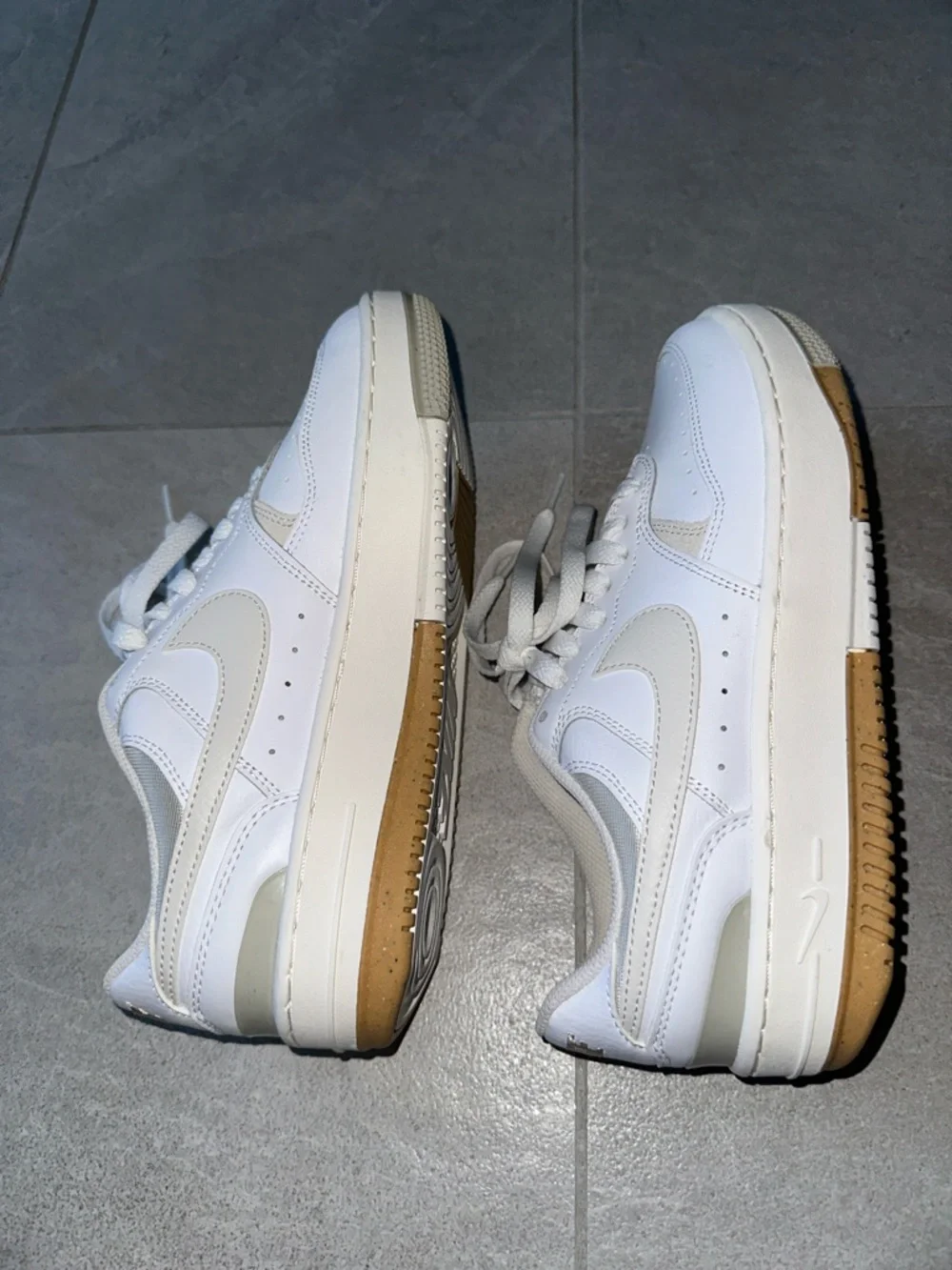 Nike White Sneakers with Cream Swoosh and Gum Outsole